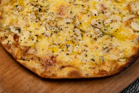 Brazilian mushroom, cheese and oregano pizza, top viewの写真素材