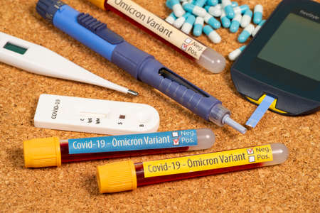 variant of covid-19 Omicron, written on blood collection tube, with various medical elements aroundの写真素材