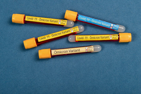 variant of covid-19 Omicron, written on blood collect tube, with various medical elements aroundの写真素材