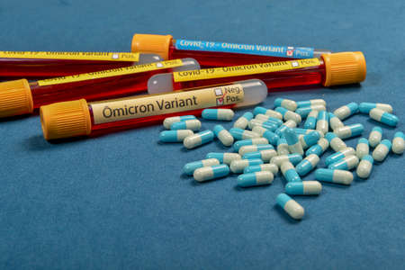 variant of covid-19 Omicron, written on blood collect tube, with various medical elements around, selective focusの写真素材