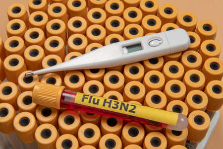 blood collection tubes labeled "Flu H3N2" symbolizing the flu epidemicの写真素材