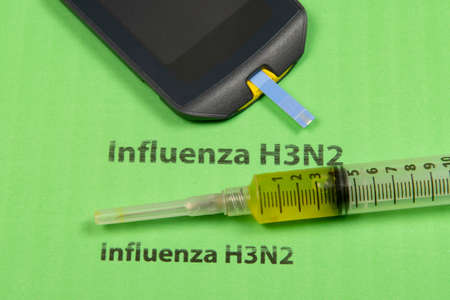 medicines, syringe, in a conceptual situation for the H3N2 flu that spreads across several countriesの写真素材