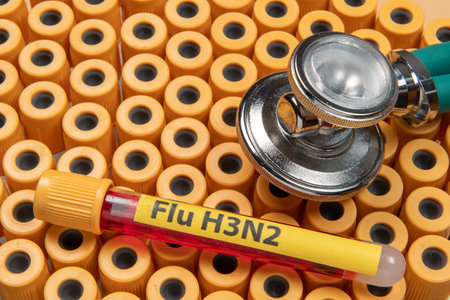 blood collection tubes labeled "Flu H3N2" symbolizing the flu epidemicの写真素材
