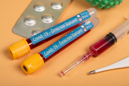 variant of covid-19 Omicron, written on blood collection tube, with various medical elements aroundの写真素材