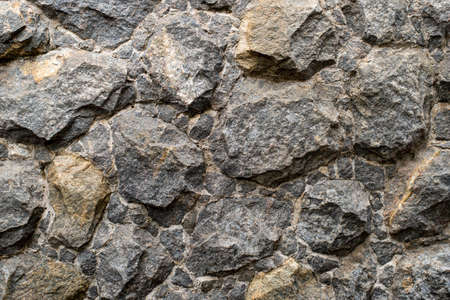 stone gravel texture lining the wall to apply as a background.の写真素材