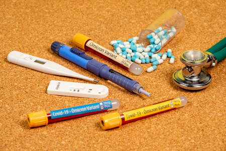 variant of covid-19 Omicron, written on blood collection tube, with various medical elements aroundの写真素材
