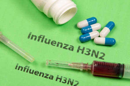 medicines, syringe, in a conceptual situation for the H3N2 flu that spreads across several countriesの写真素材