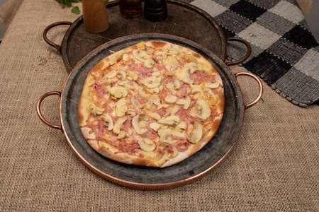 Brazilian mushroom, cheese and ham pizza, top viewの写真素材