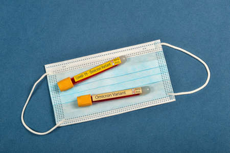 variant of  Omicron, written on blood collect tube, with various medical elements aroundの写真素材