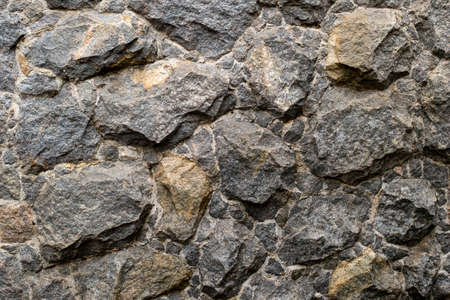 stone gravel texture lining the wall to apply as a background.の写真素材