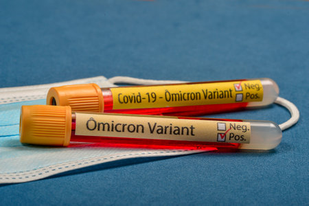 variant of  Omicron, written on blood collect tube, with various medical elements aroundの写真素材