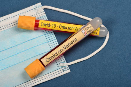 variant of  Omicron, written on blood collect tube, with various medical elements aroundの写真素材