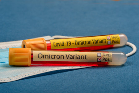 variant of covid-19 Omicron, written on blood collect tube, with various medical elements around, Selective focusの写真素材
