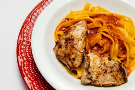spaghetti dish with red sauce and chicken, brazilian cuisineの写真素材