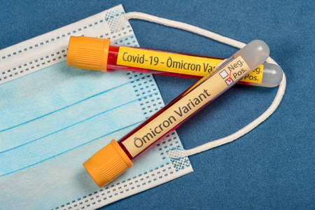 variant of covid-19 Omicron, written on blood collect tube, with various medical elements aroundの写真素材
