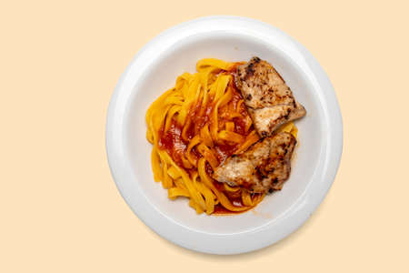 spaghetti dish with red sauce and chicken, brazilian cuisineの写真素材