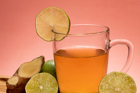 cup of tea with lemon, ginger and honey on a table