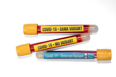 tubes with blood and labels of covid-19 and gamma, mu and omicron variants, isolated in white backgroundの写真素材