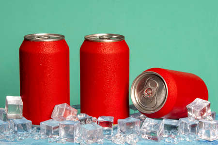 red soda can on blue background and with ice and coldの写真素材