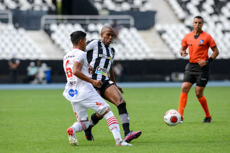 Rio, Brazil - January 30, 2022: Roberto Baggio and Fabinho players in match between Botafogo 2 vs 0 Bangu by 2nd round of Carioca Championship (Taca Guanabara) in Nilton Santos Stadiumのeditorial素材
