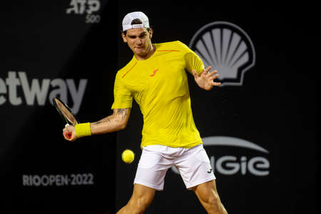 Rio, Brazil - February 12, 2022: Thiago Seyboth Wild (BRA) plays against Roberto Carballes Baena (ESP) in qualifying round match at Rio Open 2022 at Jockey Club Arena, ATP 500 tournamentのeditorial素材