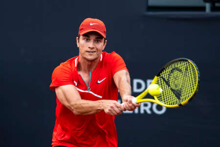 Rio, Brazil - February 13, 2022: Miomir Kecmanovic (SRB) plays against Hugo Dellien (BOL) in qualifying round match at Rio Open 2022 at Jockey Club Arena, ATP 500 tournamentのeditorial素材