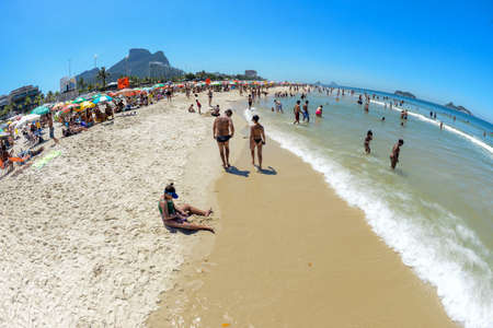 Rio, Brazil - March 01, 2022: bather's movement in the city's beach, in the west zoneのeditorial素材