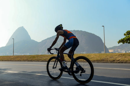 Rio, Brazil - March 13, 2022: athletes participate in a cycling race on the edge of the city, in the bay of Botafogoのeditorial素材