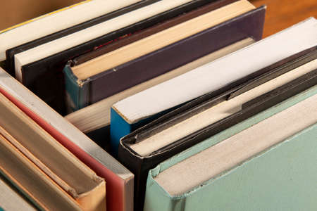 Close-up of background stack of old used books. Pile of vintage old books. Back to school. copy spaceの写真素材