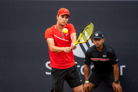 Rio, Brazil - February 13, 2022: Miomir Kecmanovic (SRB) plays against Hugo Dellien (BOL) in qualifying round match at Rio Open 2022 at Jockey Club Arena, ATP 500 tournamentのeditorial素材
