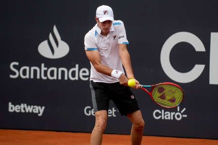 Rio, Brazil - February 12, 2022: [WC] Gustavo Heide (BRA) plays against Miomir Kecmanovic (SRB) in qualifying round match at Rio Open 2022 at Jockey Club Arena, ATP 500 tournamentのeditorial素材