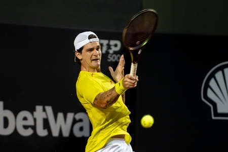Rio, Brazil - February 12, 2022: Thiago Seyboth Wild (BRA) plays against Roberto Carballes Baena (ESP) in qualifying round match at Rio Open 2022 at Jockey Club Arena, ATP 500 tournamentのeditorial素材