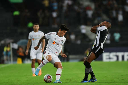 Rio, Brazil - March 21, 2022: German Cano and Chat player in match between Botafogo vs Fluminense by semifinal round of Carioca Championship in Nilton Santos Stadiumのeditorial素材