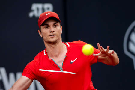 Rio, Brazil - February 13, 2022: Miomir Kecmanovic (SRB) plays against Hugo Dellien (BOL) in qualifying round match at Rio Open 2022 at Jockey Club Arena, ATP 500 tournamentのeditorial素材