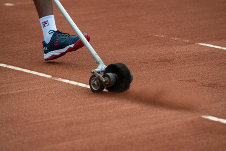 Rio, Brazil - February 12, 2022: court assistants clean and prepare the lines in qualifying round...