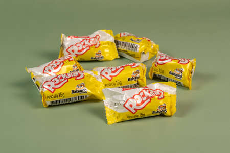 Peanut candy packaging (Pacoca Rockitas) on a green background, consumed in June Partiesのeditorial素材