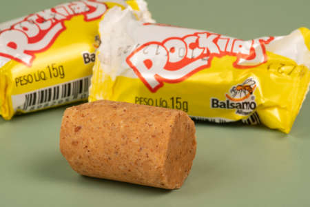 Peanut candy packaging (Pacoca Rockitas) inside a pot on a green background, consumed in June Partiesのeditorial素材