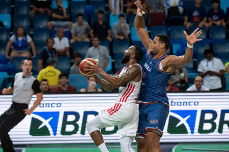 Rio, Brazil - April 09, 2022: Luis Santos and Cordero Bennet player in match between Sao Paulo (BRA) vs Bigua (URU) by final of Basketball Champions League America in Arena Carioca 1 Stadiumのeditorial素材