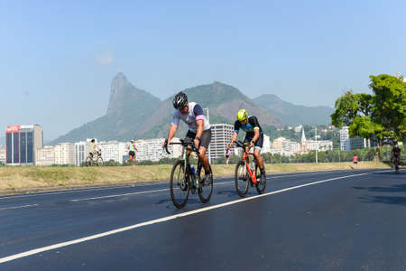 Rio, Brazil - March 13, 2022: athletes participate in a cycling race on the edge of the city, in the bay of Botafogoのeditorial素材