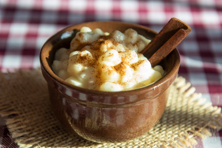 Brazilian sweet dessert, Canjica. White corn porridge with cinnamon and coconut. Consumed at June partiesの写真素材