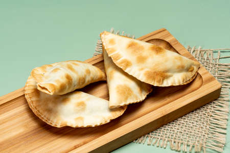 portion of bar meat pastries in a green backgroundの写真素材
