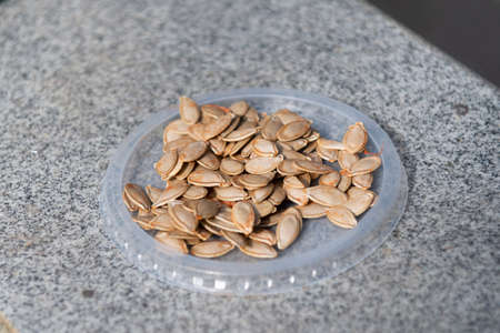 background of isolated peeled pumpkin seed kernelsの写真素材