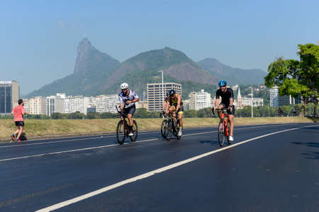 Rio, Brazil - March 13, 2022: athletes participate in a cycling race on the edge of the city, in the bay of Botafogoのeditorial素材