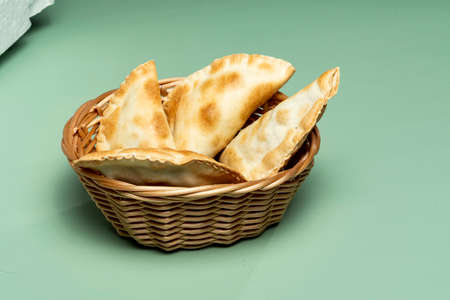 portion of bar meat pastries in a green backgroundの写真素材