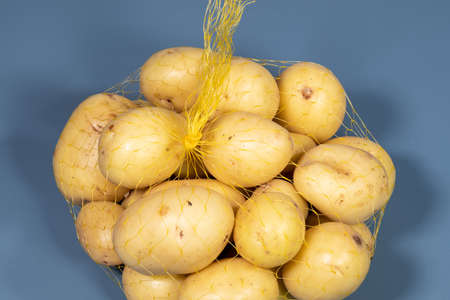 Potato - one of the products that make up the 13 items of the Brazilian basic food basket - yellow bag wiredの写真素材