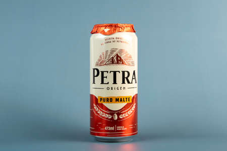 Rio de Janeiro, Brazil - March 18, 2020: Petra Pure Malt beer can background isolated in blue, can of 473mlのeditorial素材