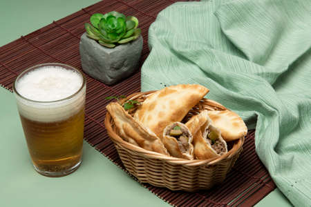 portion of bar meat pastries in a green backgroundの写真素材