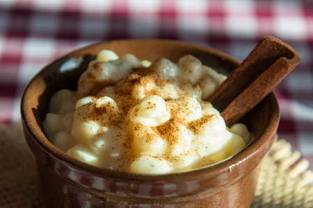 Brazilian sweet dessert, Canjica. White corn porridge with cinnamon and coconut. Consumed at June partiesの写真素材