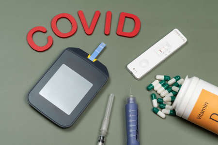 device to measure blood glucose, and the word written in green background, top viewの写真素材