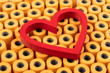 heart shape over blood collection tubes, representing coronary problemsの写真素材